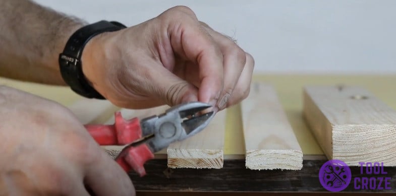 Make a flush cut on the tip of nails and screws with side cutting pliers