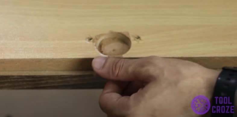 Remove loose hinge from cabinet door