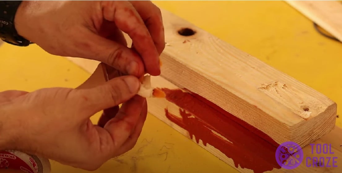 Tape the edge of a paint brush for painting narrow corners