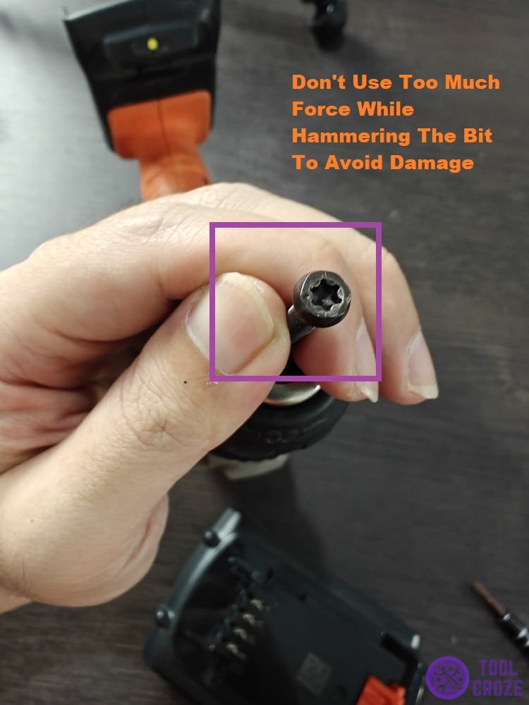 hammer the drill bit