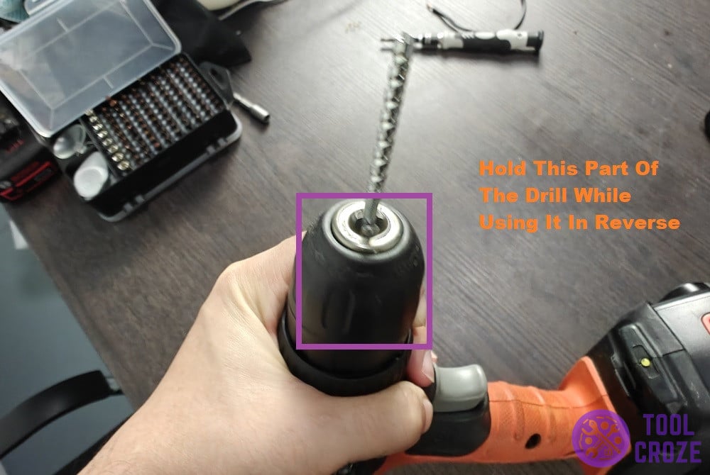 hold the chuck of the drill