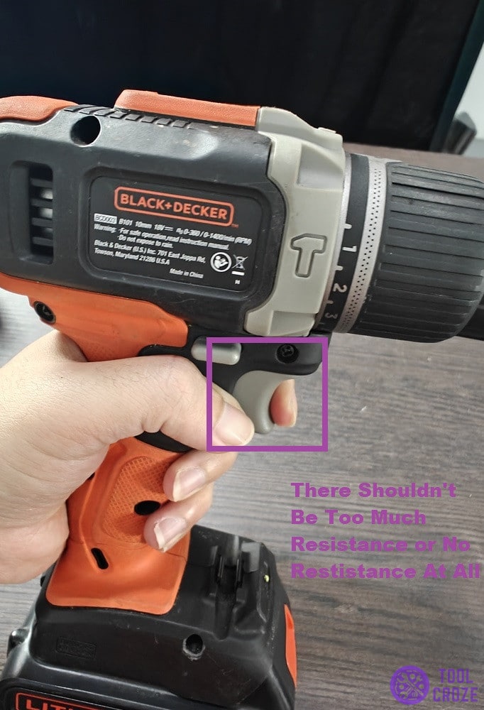 holding down trigger on drill