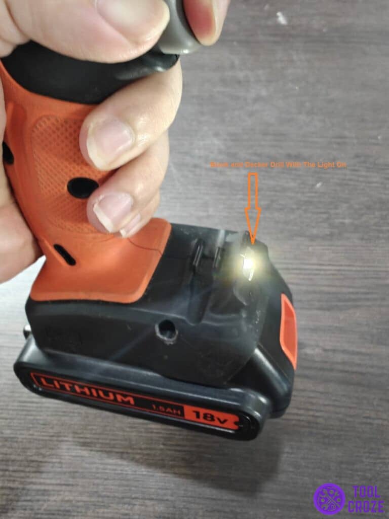 Black and Decker drill with the light on