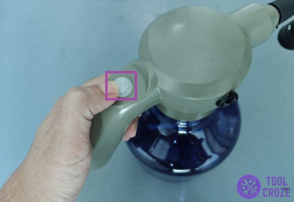 button to release water