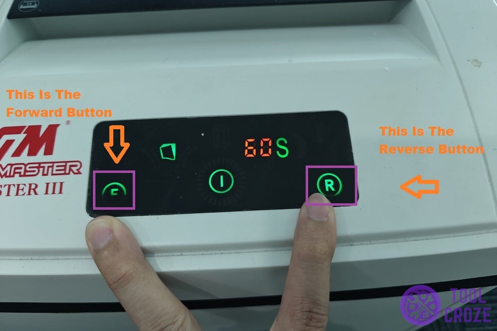 forward and reverse buttons on paper shredder