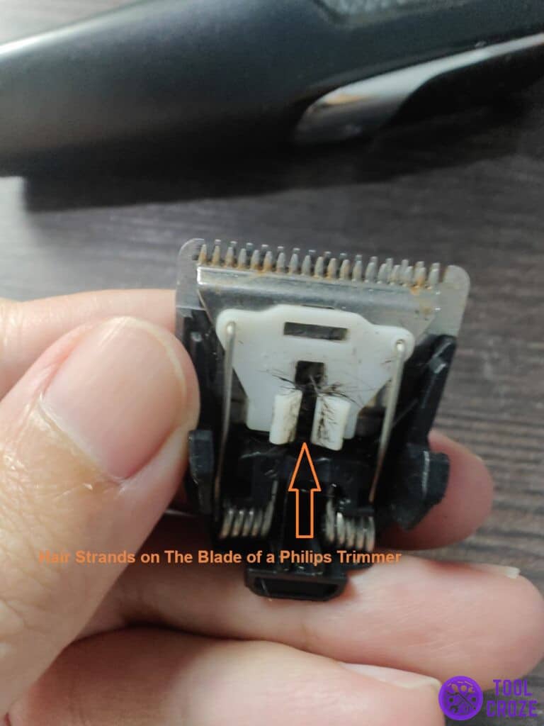 hair strands on the blade of a Philips trimmer