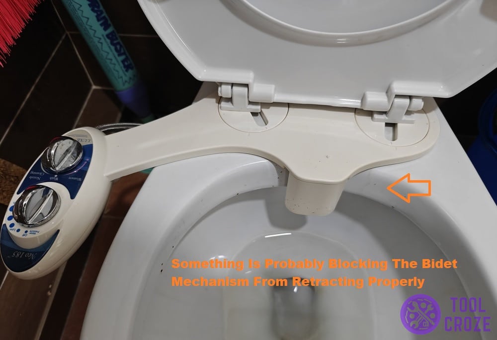 not retracting from toilet