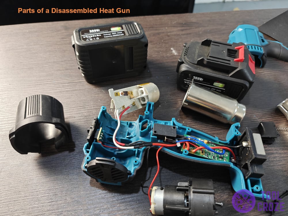 parts of a disassembled heat gun
