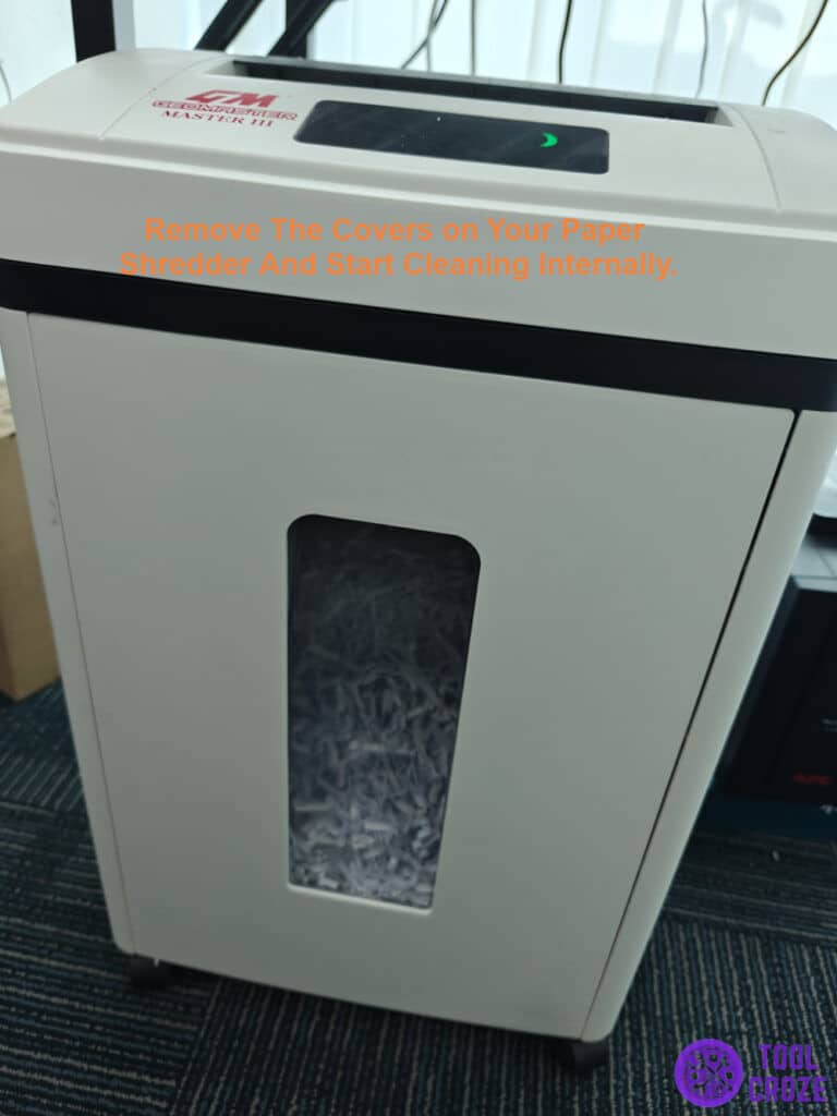 remove the covers on your paper shredder and start cleaning internally.