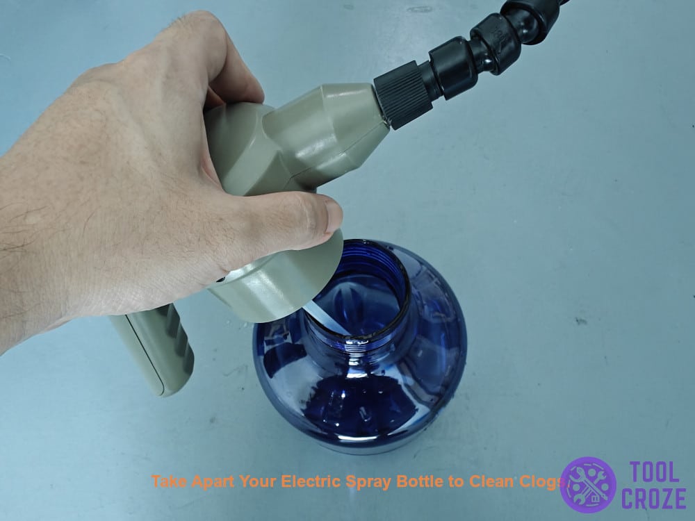 take apart electric spray bottle to clean clogs