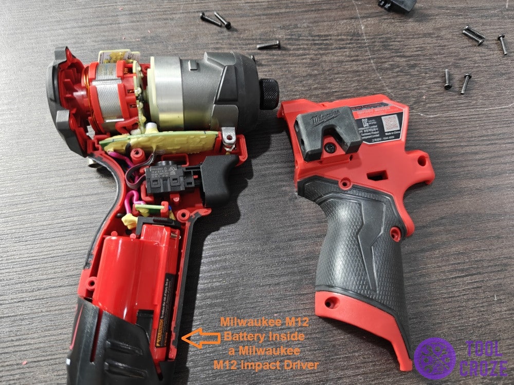 Milwaukee M12 battery inside a Milwaukee M12 impact driver