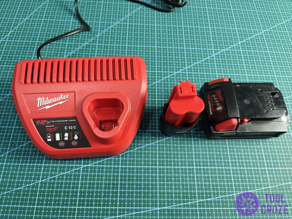 Milwaukee M12 charger with some batteries