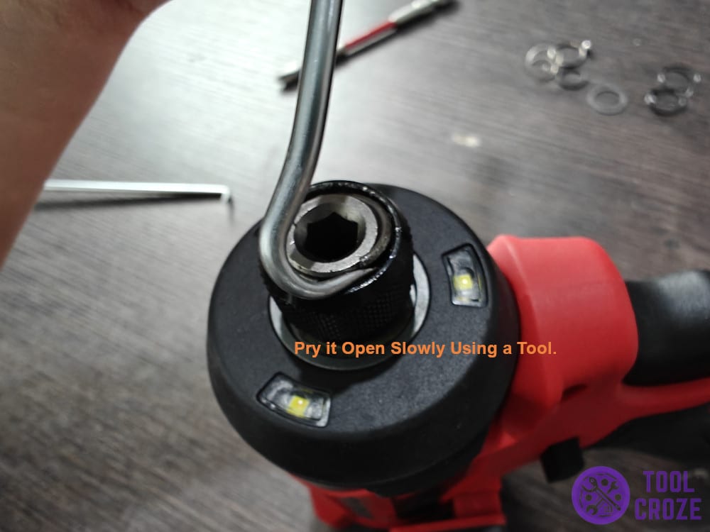 Pry it open slowly using a tool