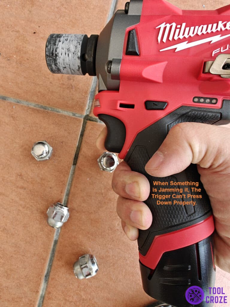 When something is jamming it, the trigger can't press down properly.
