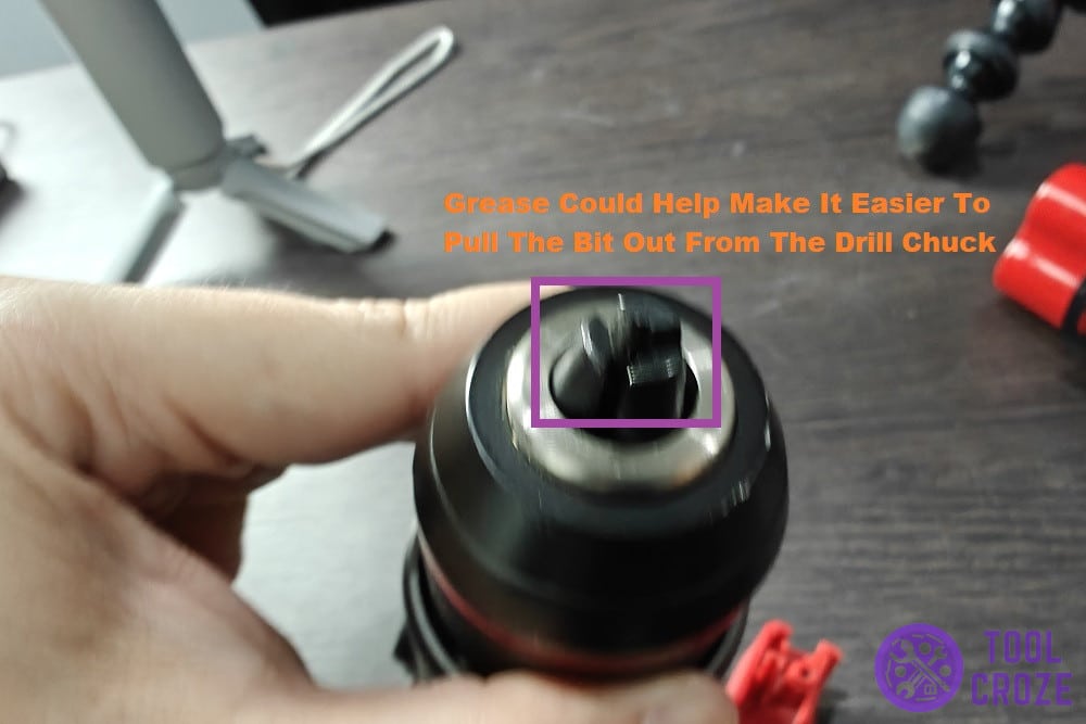 apply some grease around the chuck to loosen the bit