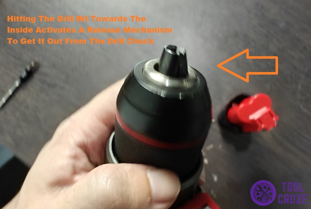 hit the bit towards inside to activate release mechanism