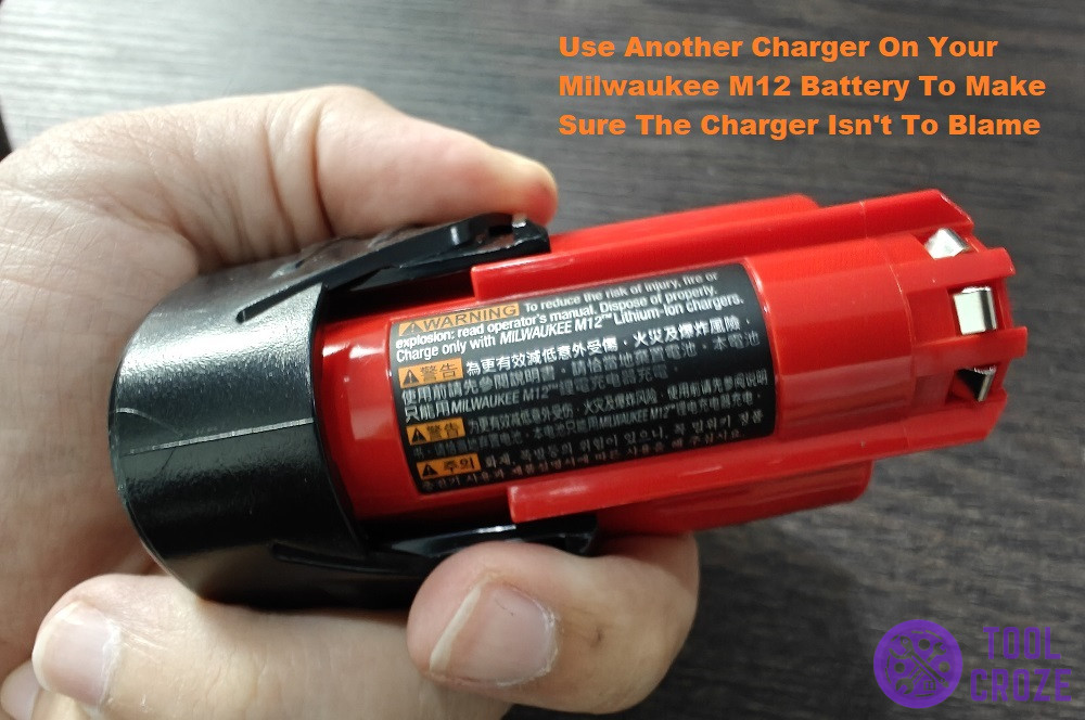 put your milwaukee battery on another charger to test it