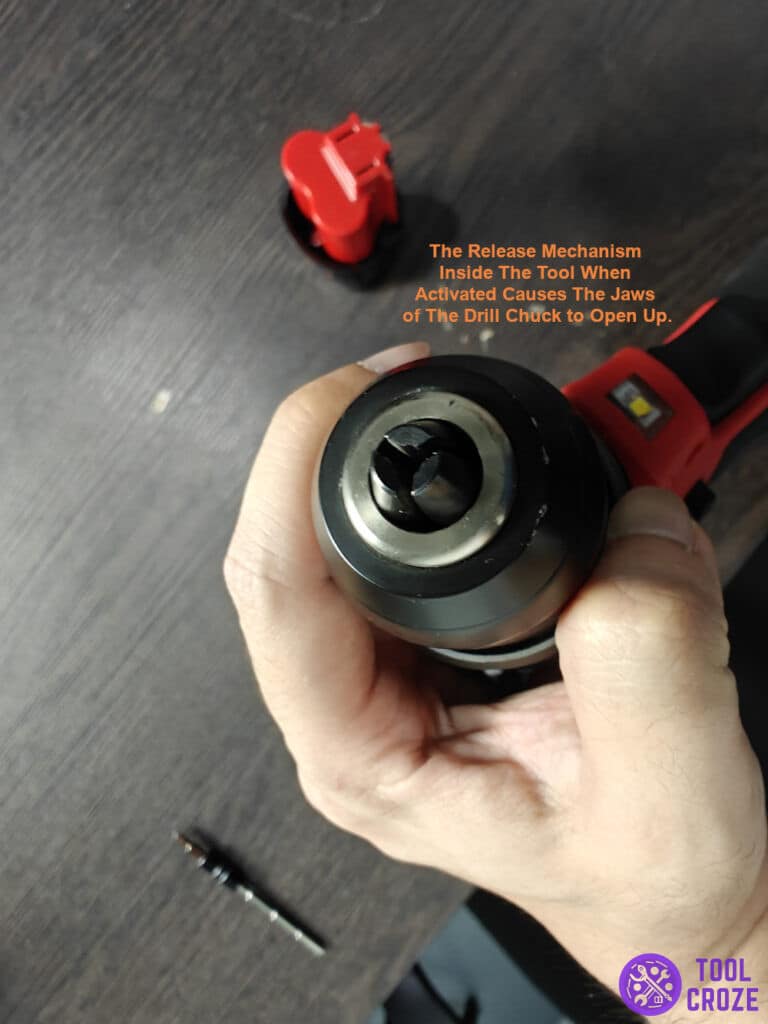release mechanism inside the tool causes the jaws of the drill chuck to open up.