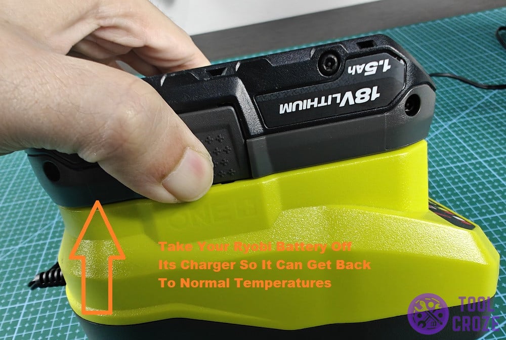 remove the battery from the ryobi charger