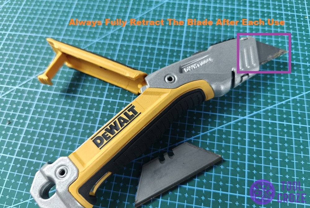 retract the blade to fully fold the utility knife