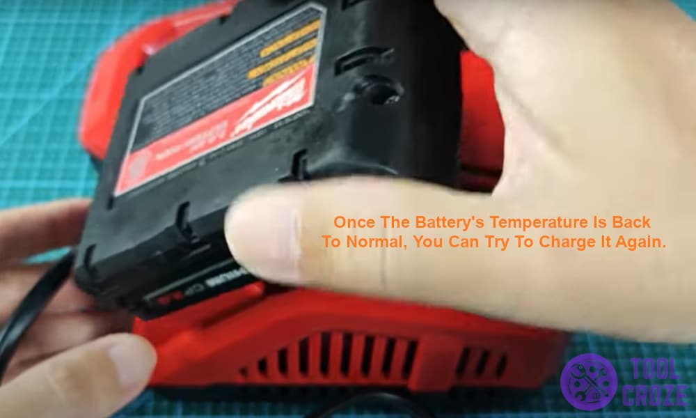 Once the battery's temperature is back to normal, you can charge it again.