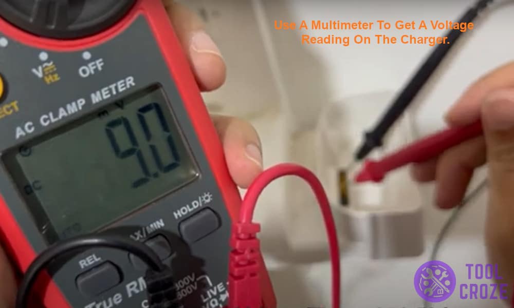 Use a multimeter to get a voltage reading on the charger.