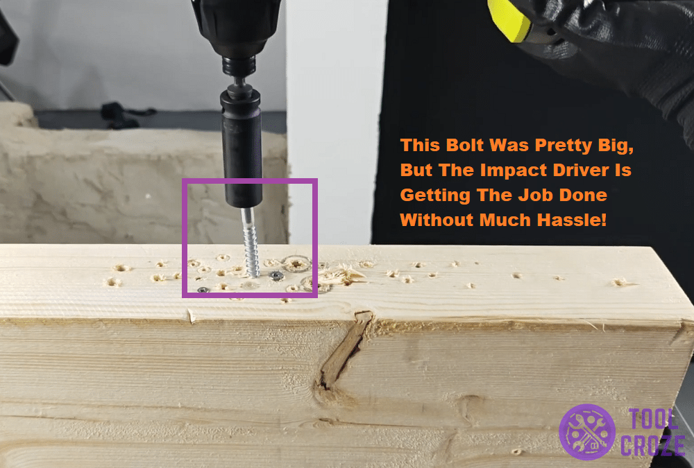 driving big metal bolt through wood using ryobi impact driver