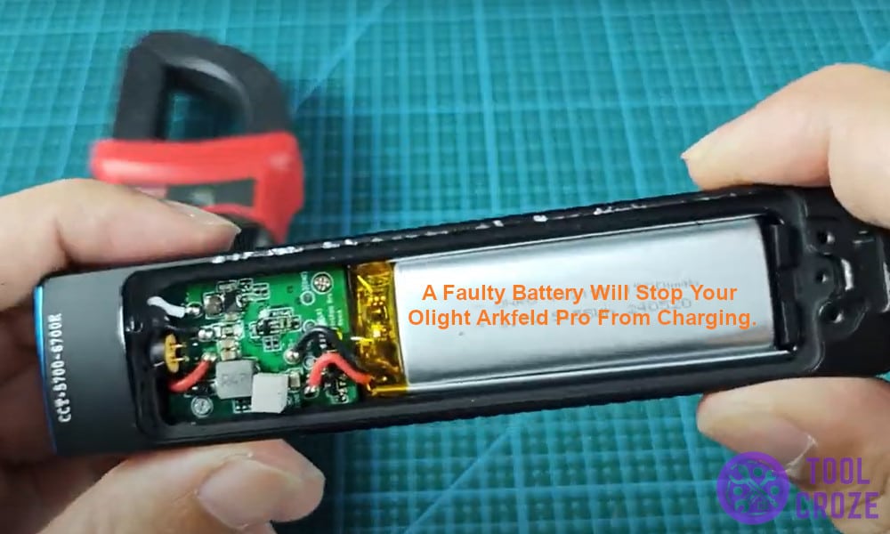 A faulty battery will stop your Olight Arkfeld Pro from charging.