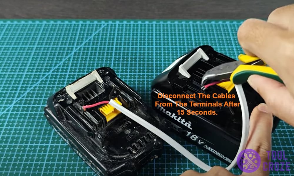 Disconnect the cables from the terminals after 15 seconds.
