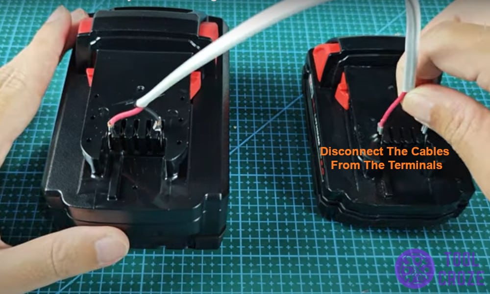 Disconnect the cables from the terminals
