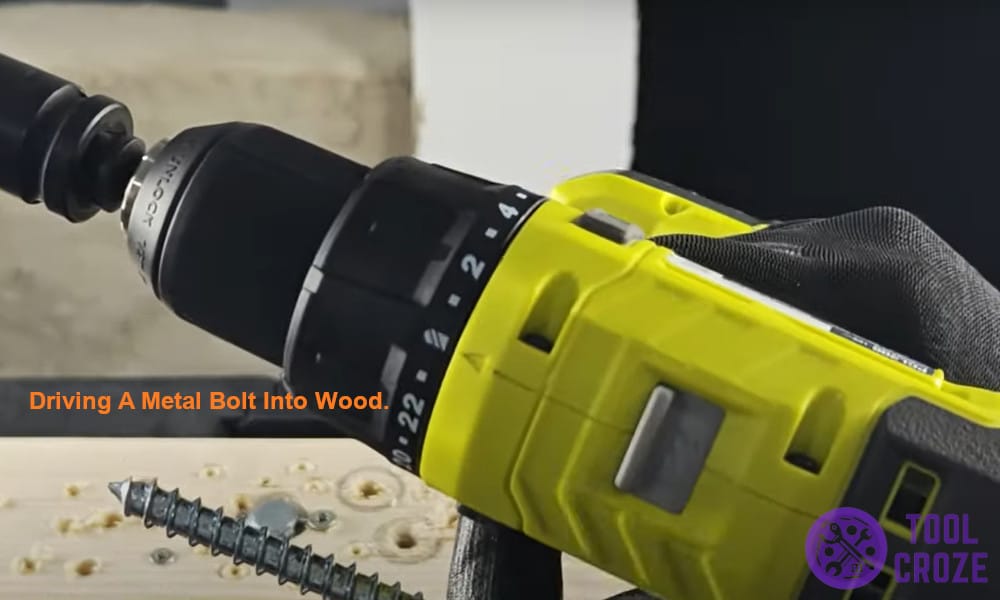 Driving a metal bolt into wood.