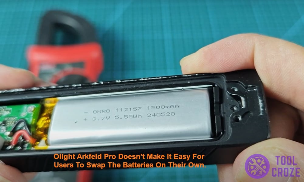 Olight Arkfeld Pro doesn't make it easy for users to swap the batteries on their own.