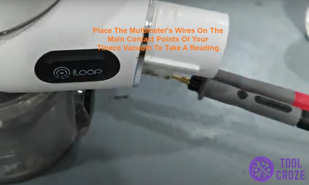 Place the multimeter's wires on the main contact points of your Tineco vacuum.