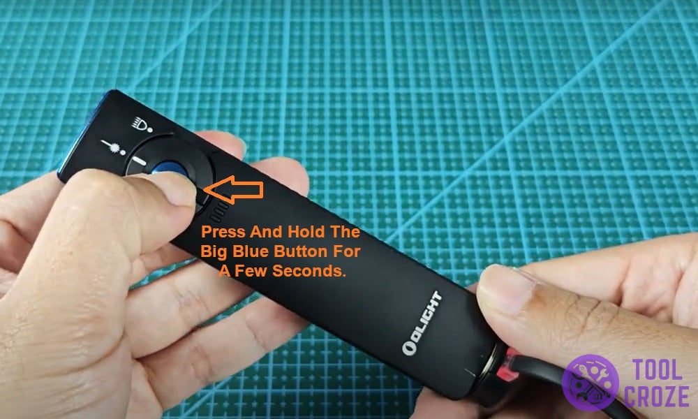 Press and hold the big blue button for a few seconds.