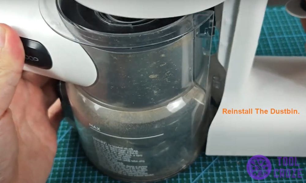 Reinstall the dustbin.