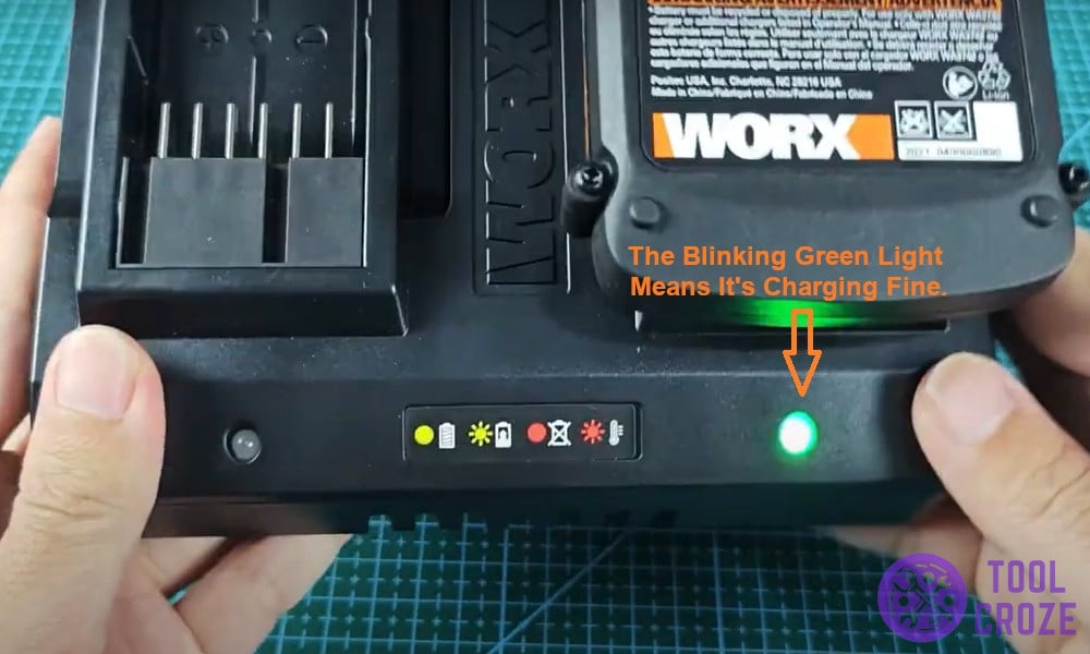 The blinking green light means it's charging fine.