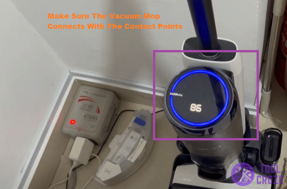 adjust the vacuum mop's position on charging base