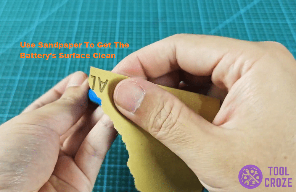 clean the surface of the pen light battery