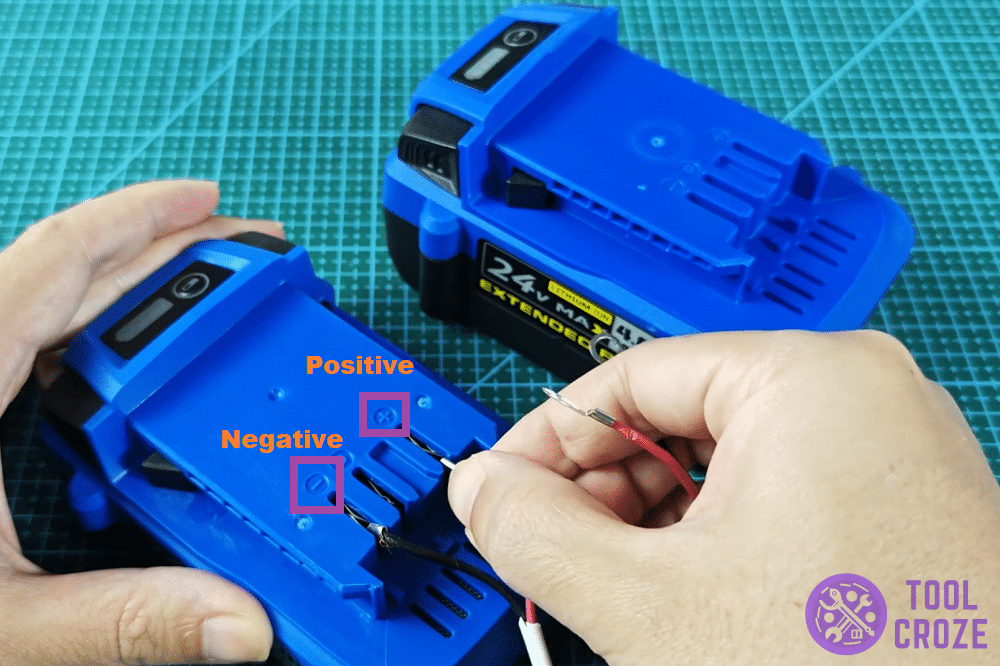 connect terminals of both kobalt batteries