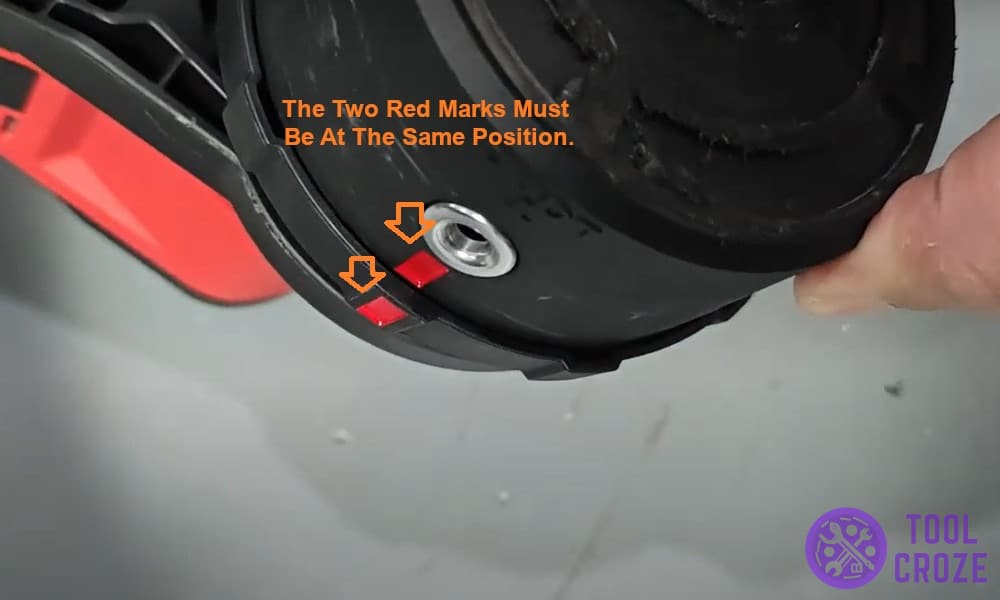 The two red marks must be at the same position.