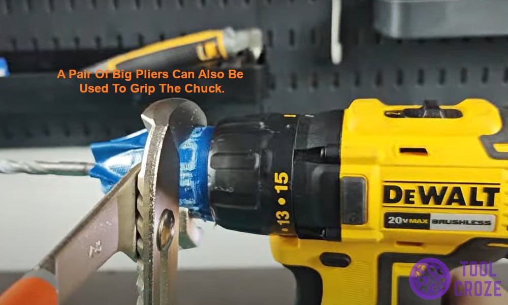 use a pair of big pliers to grip the chuck.