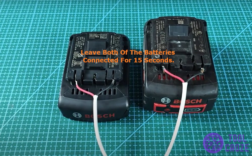 Leave both of the batteries connected for 15 seconds