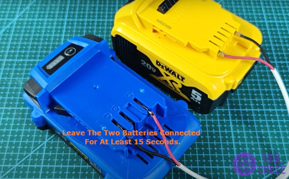 Leave the two batteries connected for at least 15 seconds