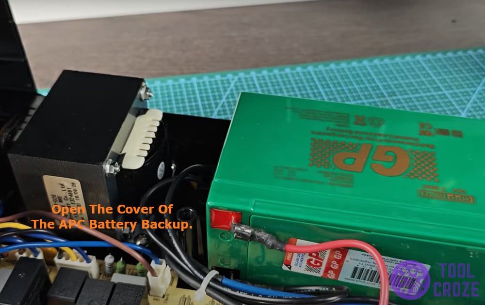 Open the cover of the APC battery backup