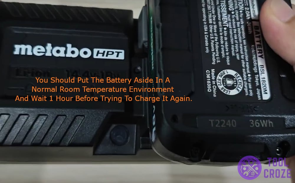 put battery aside in a normal room temperature and wait 1 hour before trying to charge again.