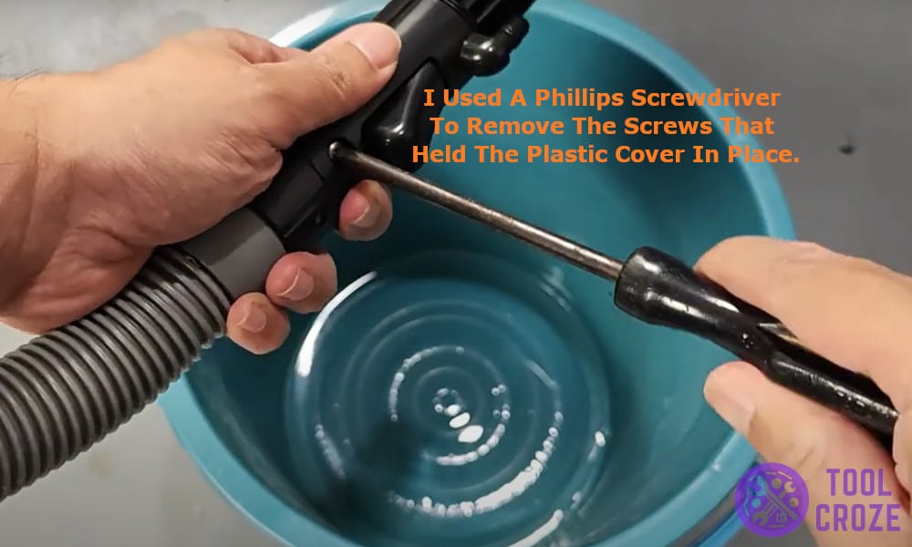 Phillips screwdriver to remove the screws that held the plastic cover in place.