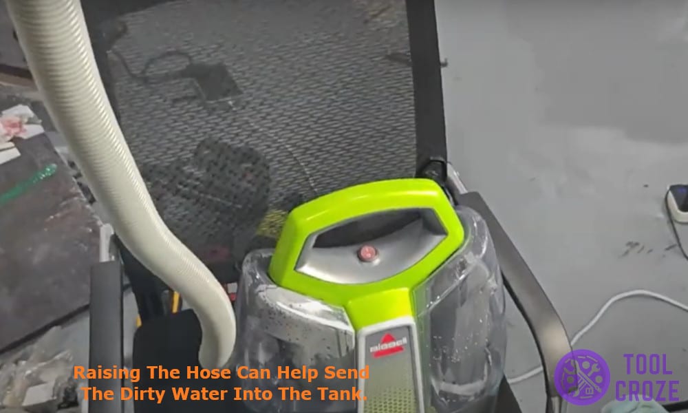 Raising the hose can help send the dirty water into the tank