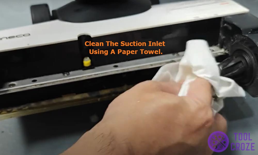clean the suction inlet using a paper towel