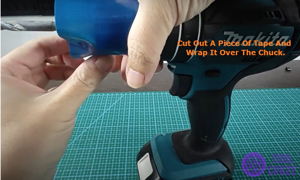 cut out a piece of tape and wrap it over the chuck