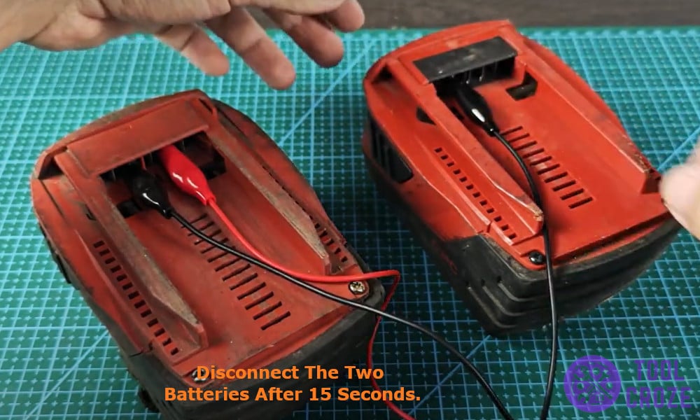 disconnect the two batteries after 15 seconds.